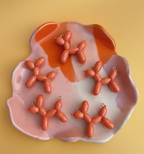 Charm chien corail.png